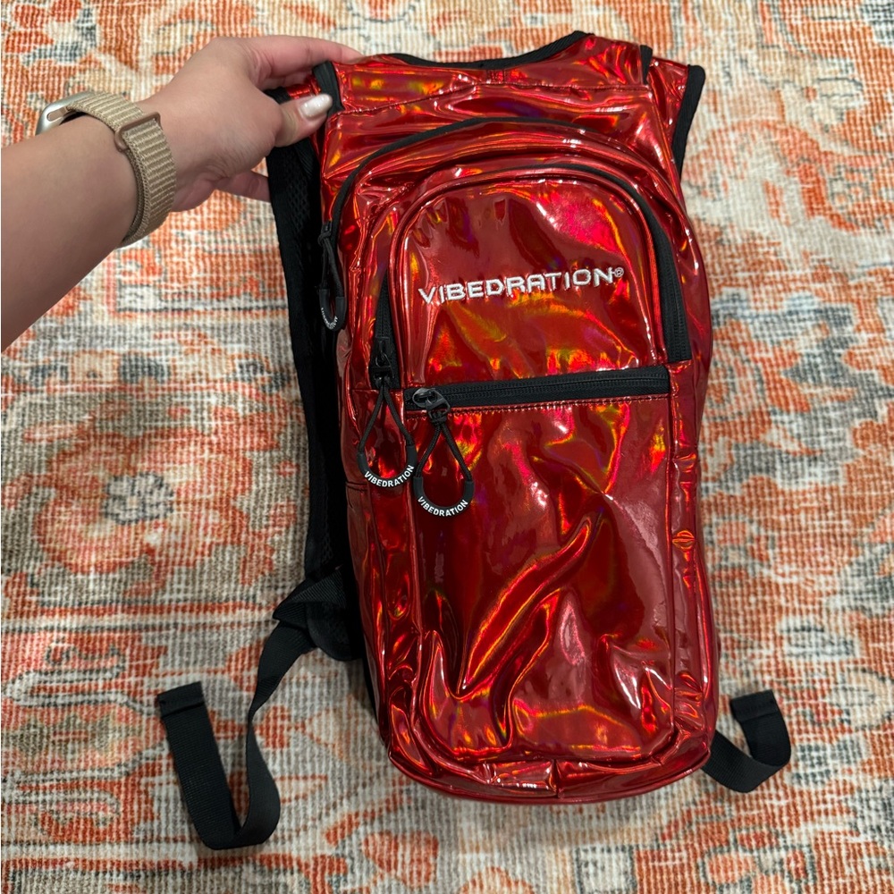 Vibedration - red holographic hydration pack